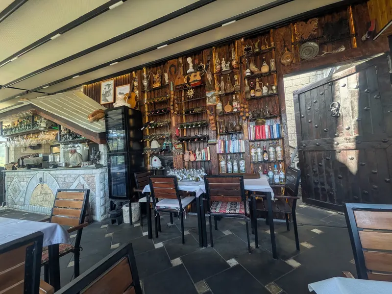 The bar and set tables under the wall of collected objects