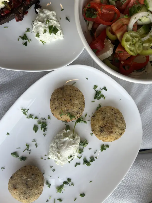 Qifqi, Gjirokastër rice balls with herbs, served with yogurt